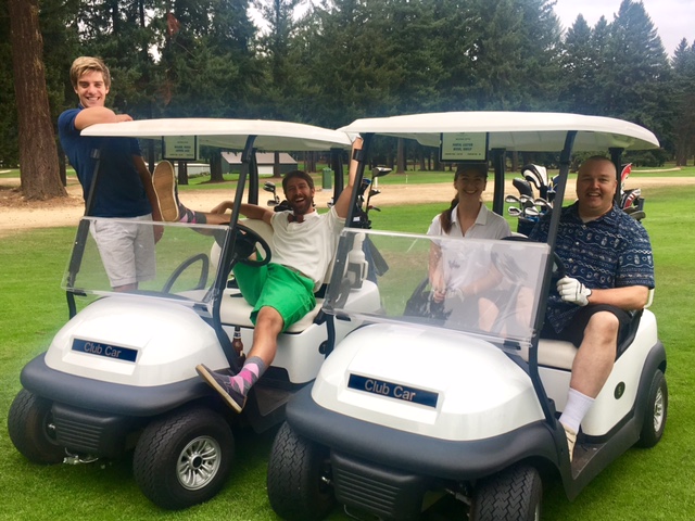 golfers in golf carts